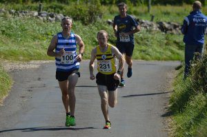 Philip Goss battles with eventual winner Neil Weir